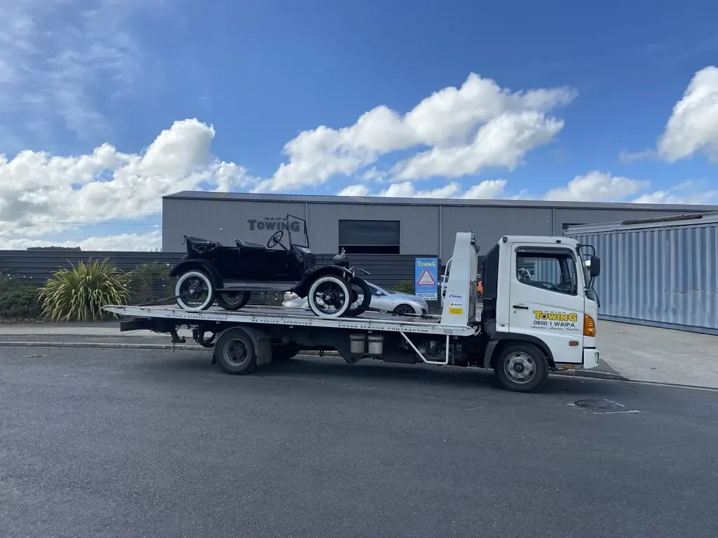 Classic car being transported on Waipa Towing flatbed